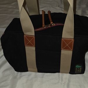 Dooney & Bourke Black Canvas Travel Duffel with Tan Straps